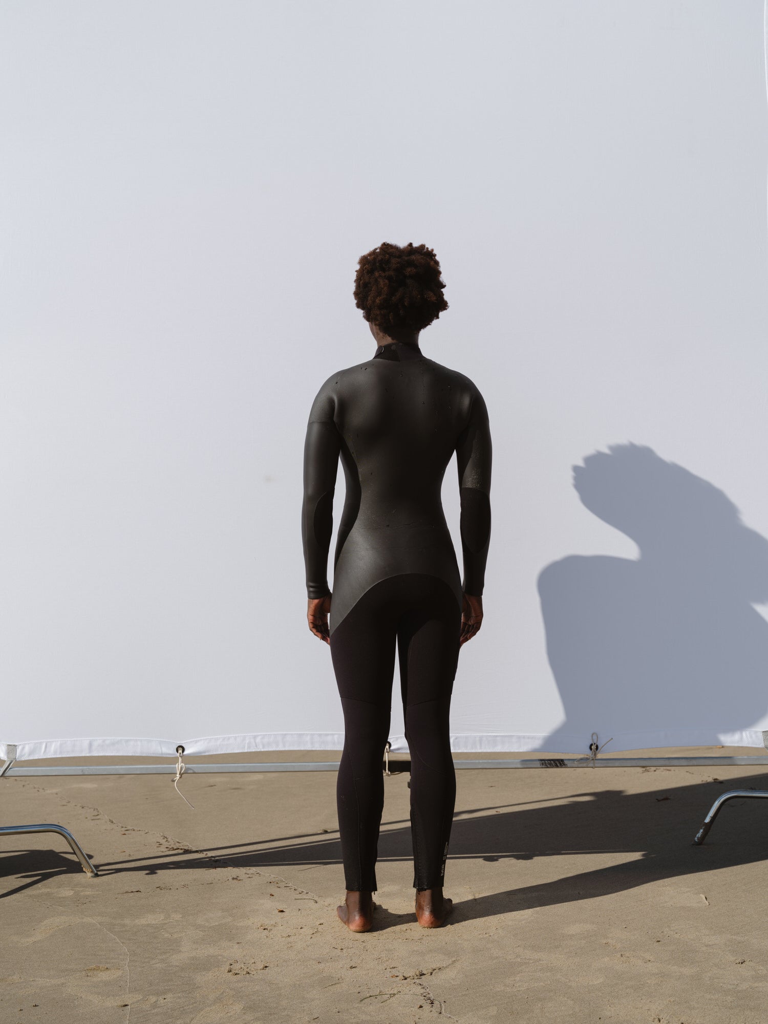 Back view of Basalt women’s Smoothskin 4/3mm wetsuit