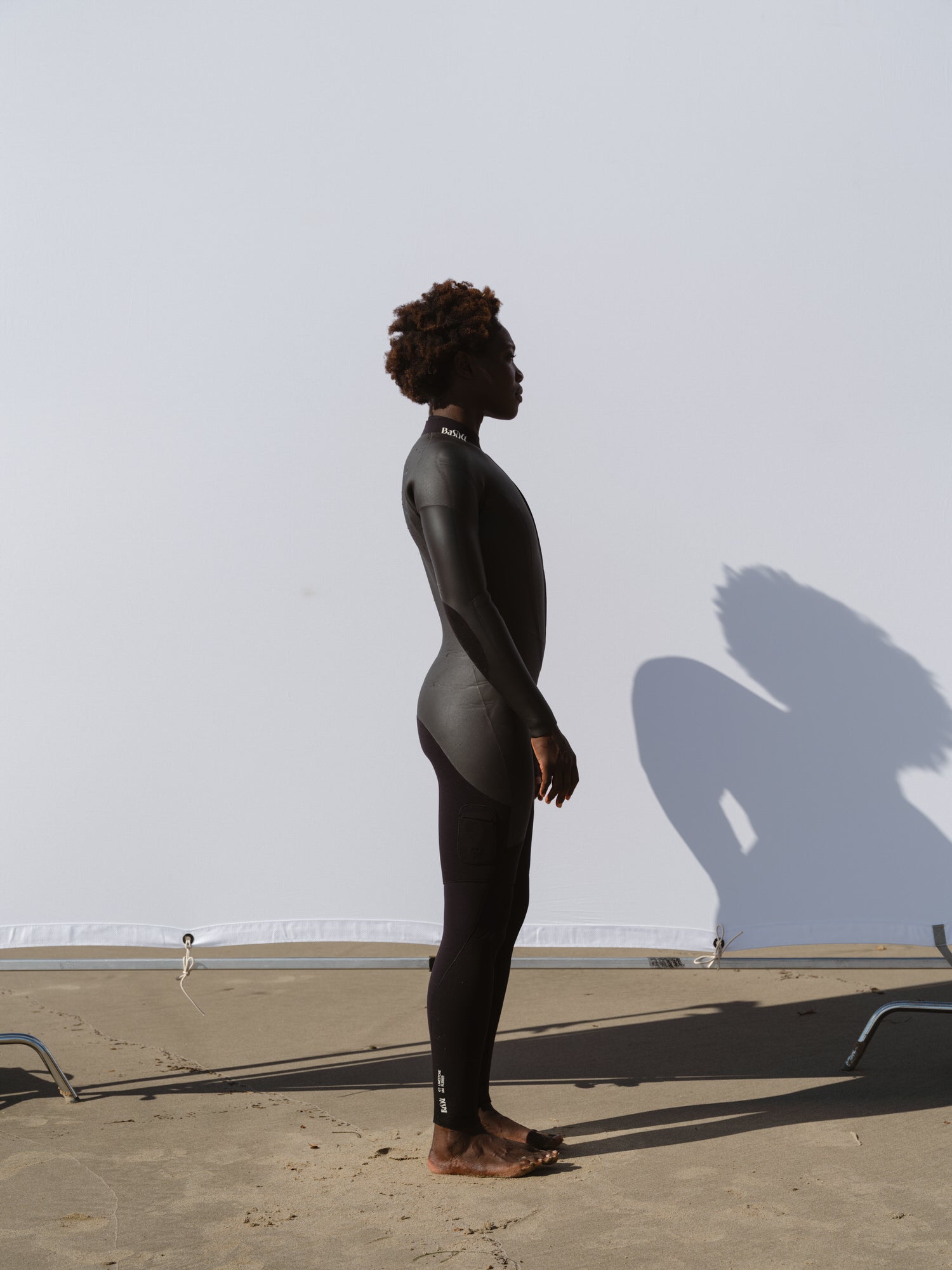 Side view of Basalt women’s Smoothskin 4/3mm wetsuit